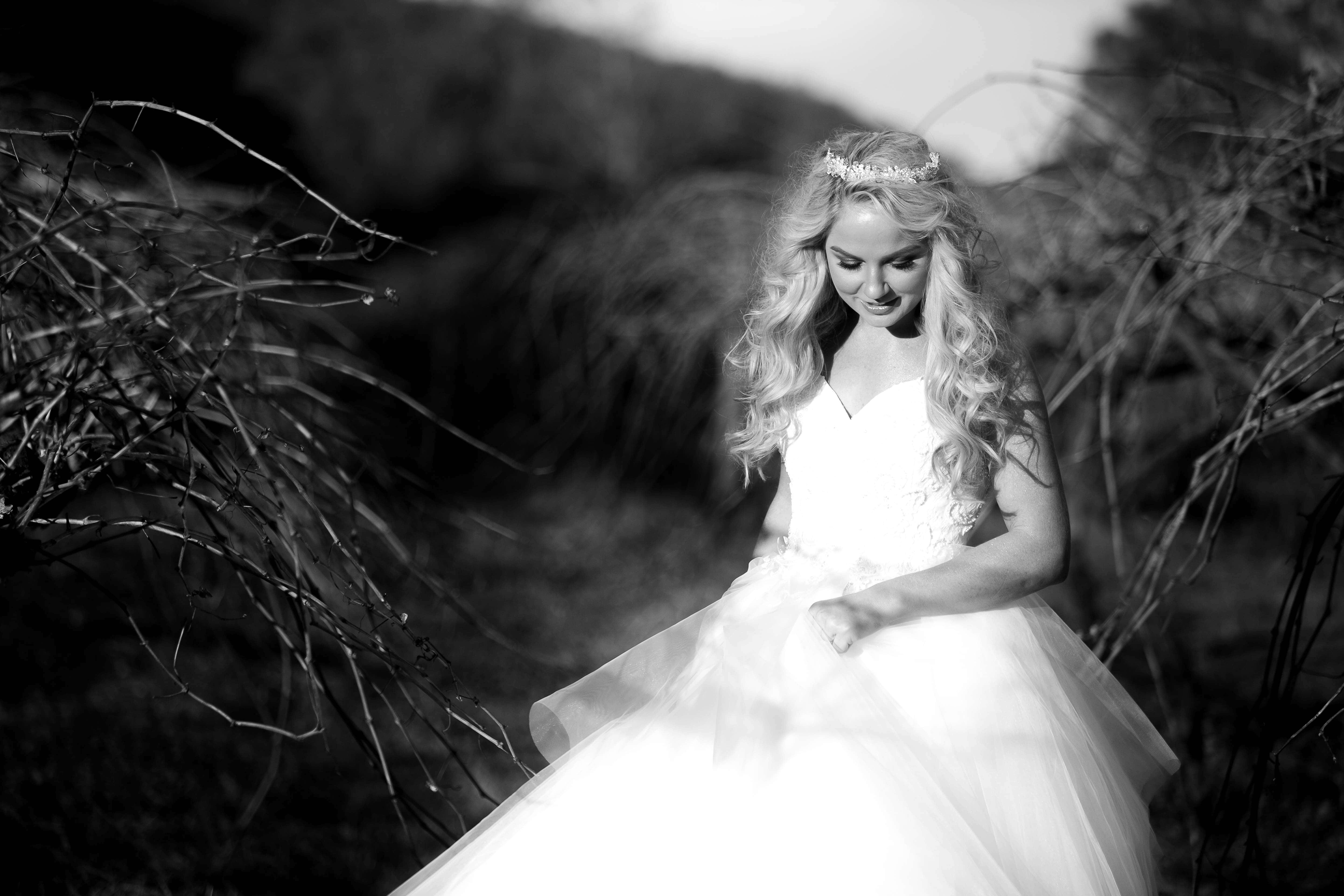 laughing bridal portrait in the grapevines at Stonehurst weddings